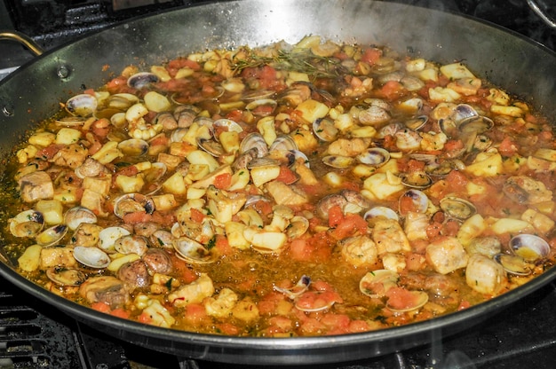 Cooking an exquisite seafood paella