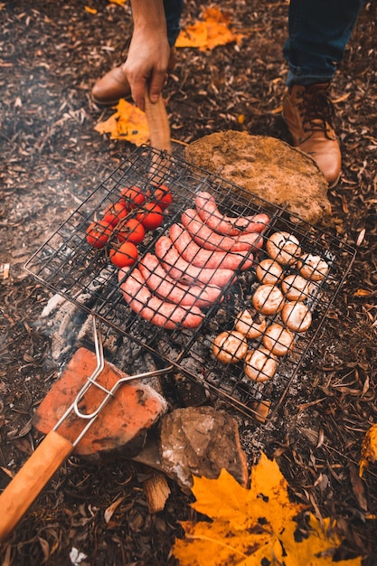 Cooking food on bonfire camping concept