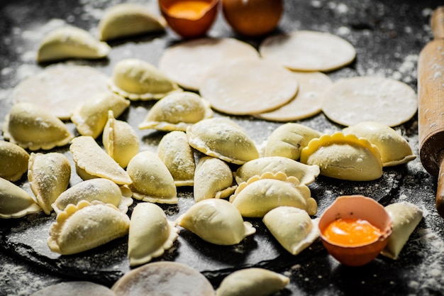 Cooking homemade dumplings with potatoes