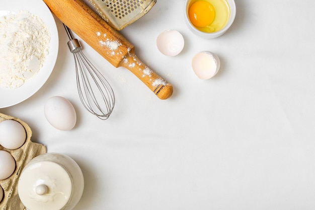 Cooking pancake on white background top view ingredients for making