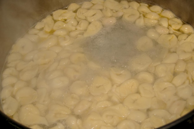 Cooking a pot of homemade italian ravioli