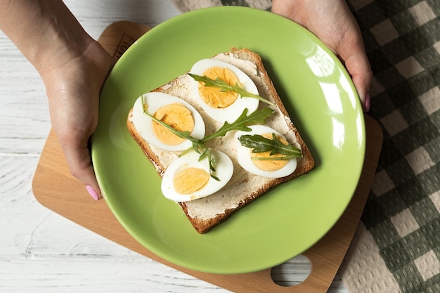 Cooking toast with boiled egg top view