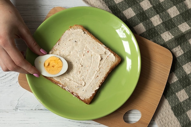 Cooking toast with boiled egg, top view