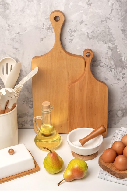 Cooking utensil and ingredients for cooking recipe on kitchen table Front view