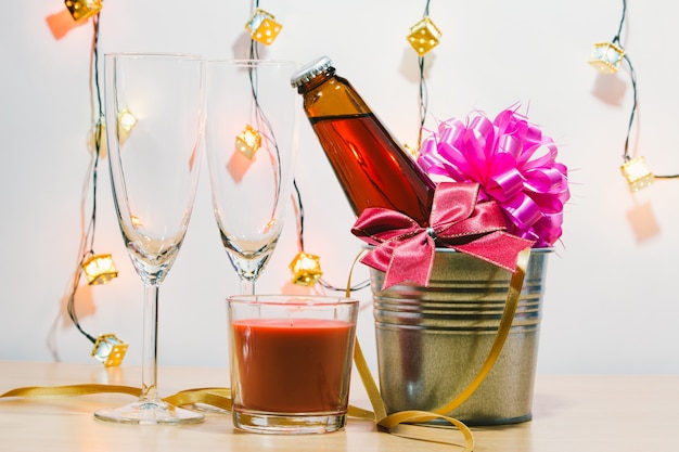 Cool Champagne and glass prepare for Celebration. Red Candle in Christmas 