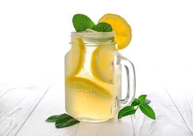 Cool freshly made lemonade lemonade with mint on white background