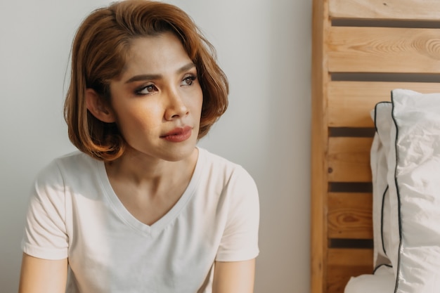 Cool looks woman in white tshirt and jean relax in her apartment room