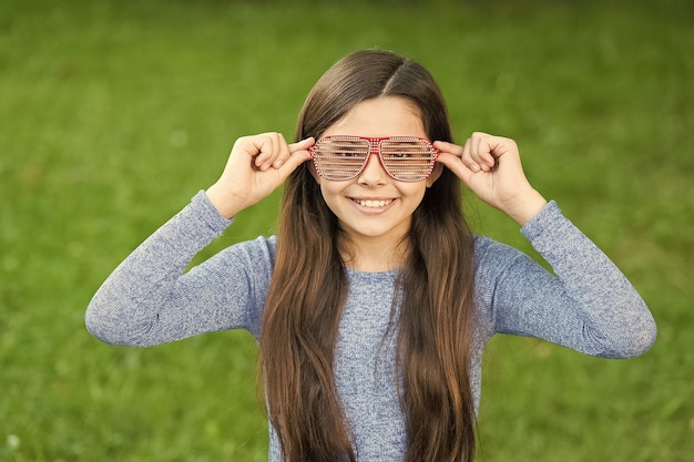 Cool style of little girl with sunglasses relaxing summer day cheerful mood concept