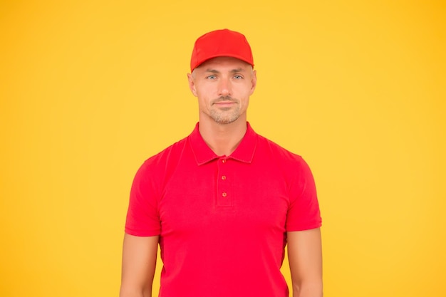 Cool and stylish Hipster yellow background Handsome man in trendy hipster style Unshaven hipster wear red baseball cap Hipster lifestyle Fashion and style Casual trend