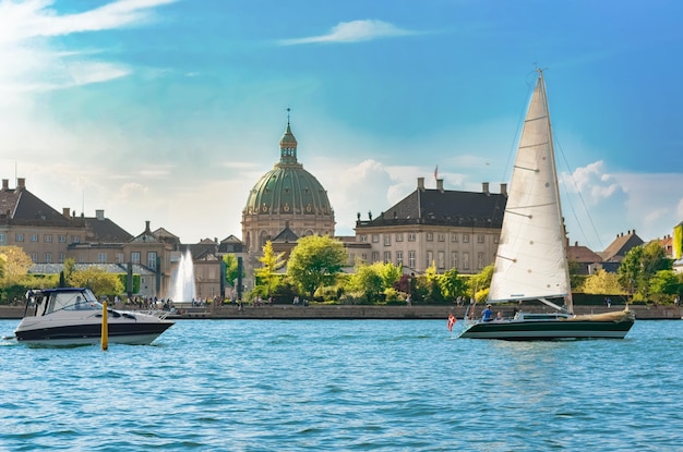 Copenhagen skyline yacht and boats in city harbor Denmark