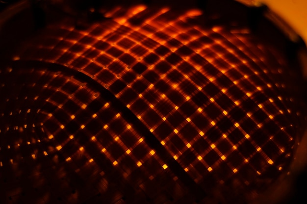 Photo a copper bowl with a red light in the middle