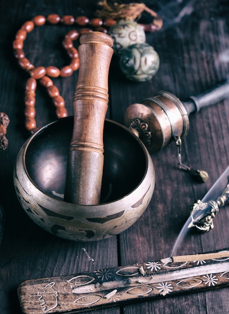 Copper singing bowl and a wooden stick 