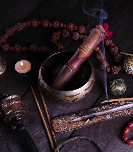 Copper singing bowl and a wooden stick