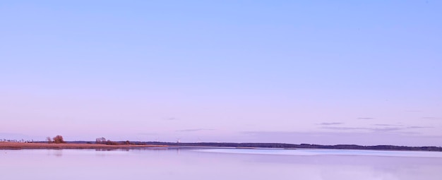 Copy space sea and ocean view with purple sky over calm serene and peaceful beach Landscape of relaxing tropical and remote seascape on a coastal island Summer vacation and holiday destination