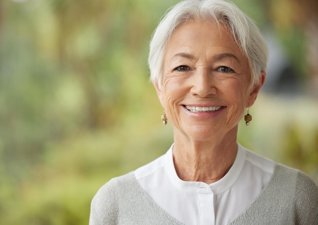 Copyspace with smiling senior woman Portrait of a happy lady with grey hair enjoying a carefree retirement Face of cheerful relaxed and wise old pensioner feeling optimistic about life and ageing