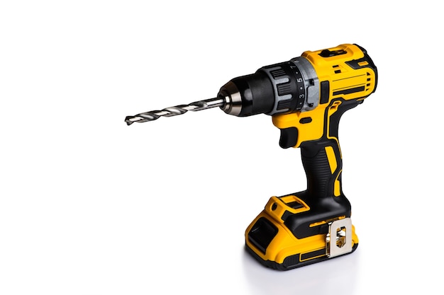 Cordless drill and a drill on a white background