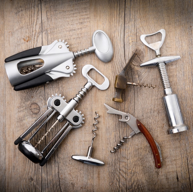 Corkscrew collage in wooden background