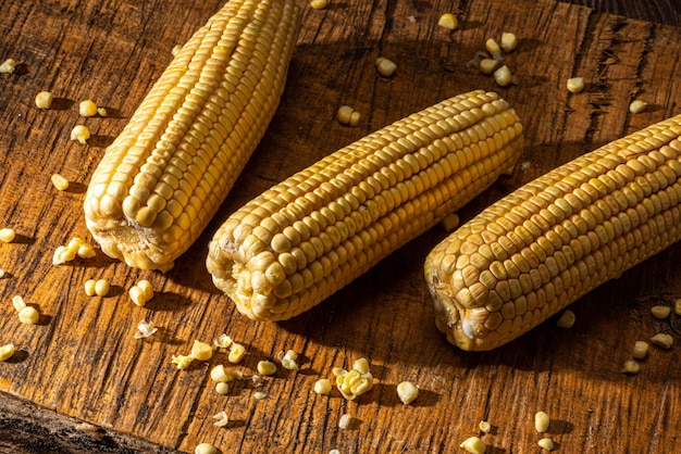 Corn on the cob on rustic wooden background