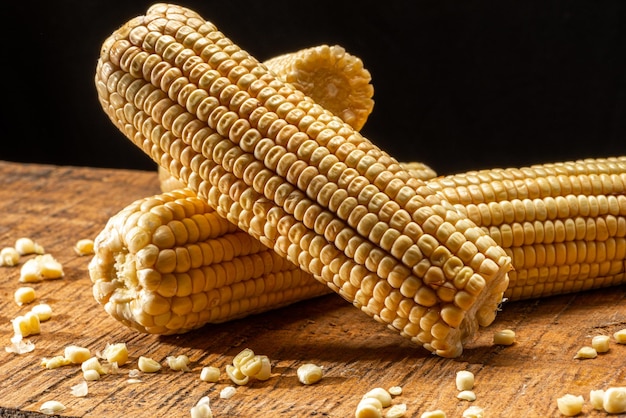 Corn on the cob on rustic wooden background