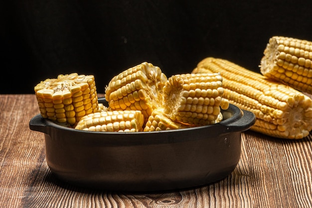 Corn on the cob on rustic wooden background