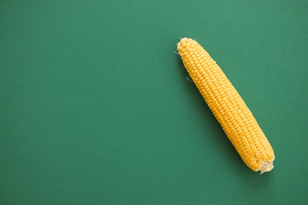 Corn isolated on green background