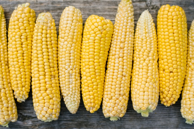 Corn on the old wooden, organic food store, fresh sweet yellow corn, agricultural products for human consumption