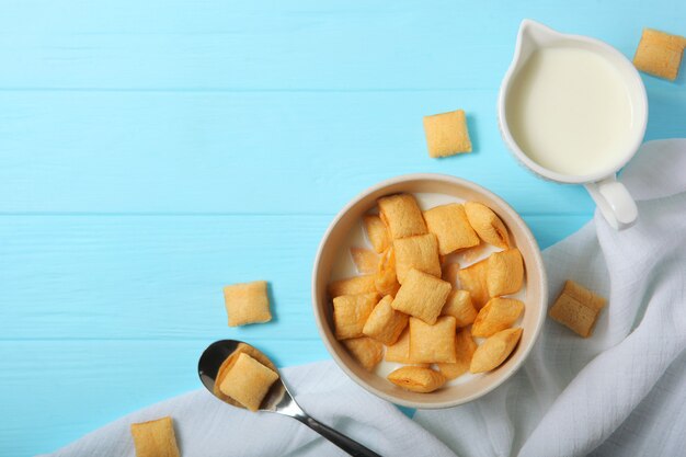 Corn pads with milk for breakfast on the table closeup