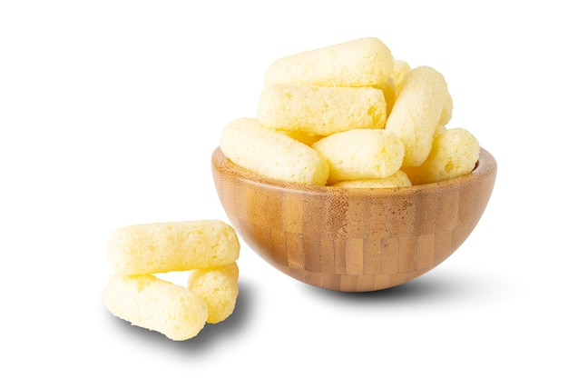 Corn sticks in wooden bowl isolated on a white background