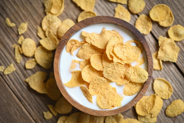 Cornflakes bowl breakfast food and snack for healthy food concept morning breakfast fresh whole grain cereal cornflakes with milk on table food background