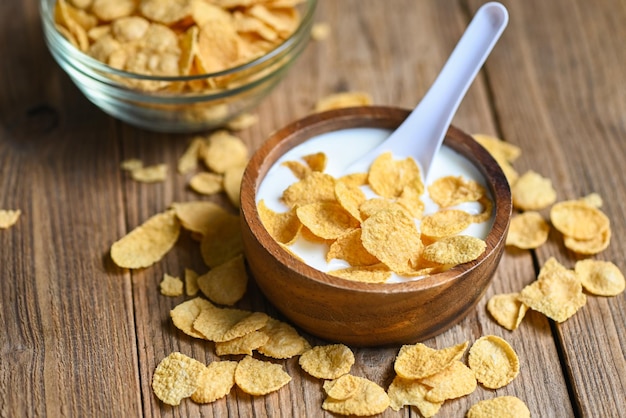 Cornflakes bowl breakfast food and snack for healthy food concept morning breakfast fresh whole grain cereal cornflakes with milk on table food background