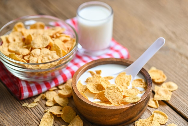 Cornflakes with milk on wooden table background cornflakes bowl breakfast food and snack for healthy food concept morning breakfast fresh whole grain cereal