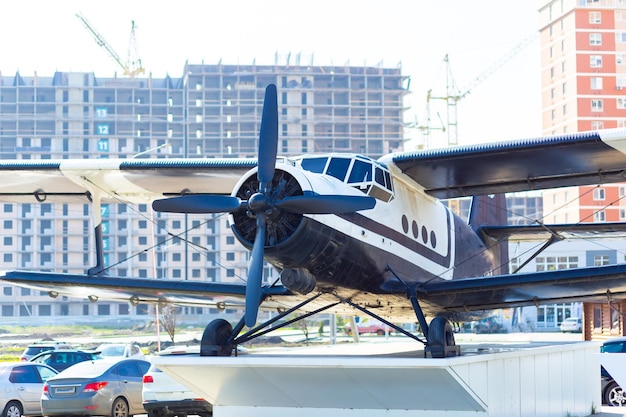 Cornflower blue plane on a pedestal as a closeup monument