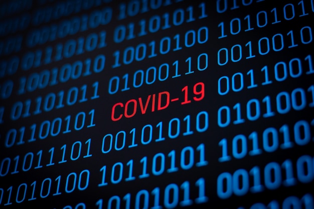 Coronavirus outbreak. Covid-19 inscription in binary code of data on computer screen