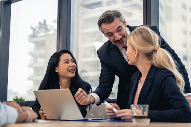 Corporate business team and manager in a meeting. Young team of coworkers making great business discussion in modern coworking office. Teamwork people concept