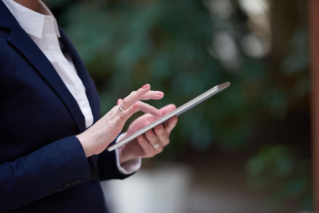 corporate business woman working on tablet computer  at modern office interior