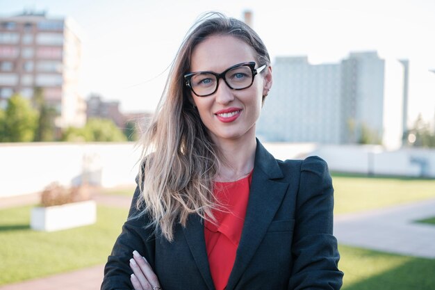 Corporate portrait of businesswoman outdoors in business area Concept business director leader