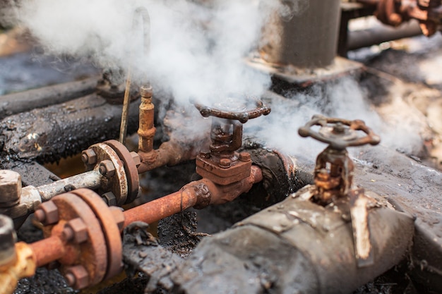 Corrosion rusty through valve tube steam gas leak pipeline at insulation