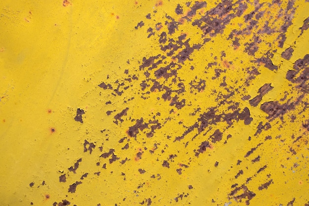 Corrosion on yellow paint background