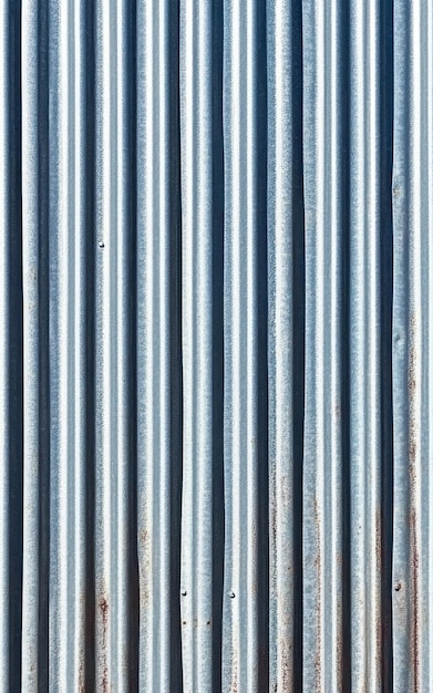 Photo corrugated metal sheet ridged with repeating wavy patterns