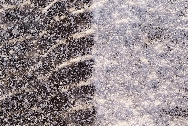 Corrugated trace of the auto tire in the winter on ice with the snow