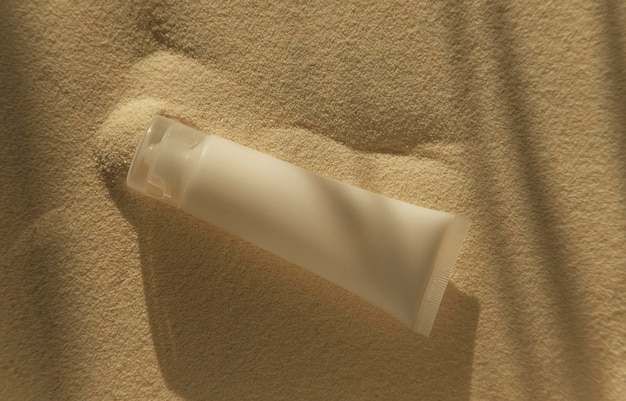 cosmetic bottle mockup on sand