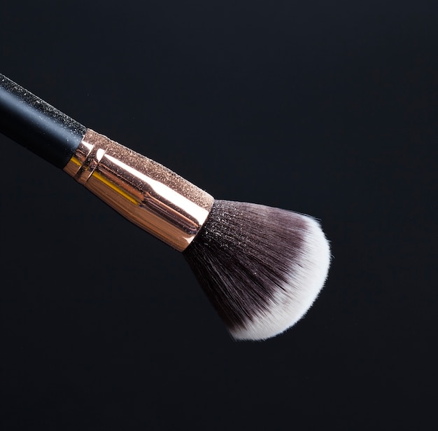 cosmetic brushes on black