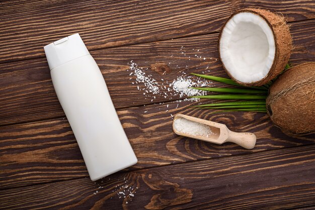 cosmetic and cream bottle with open coconut