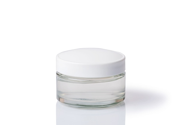 Cosmetic cream in a white jar. On a white isolated background. Skin care.