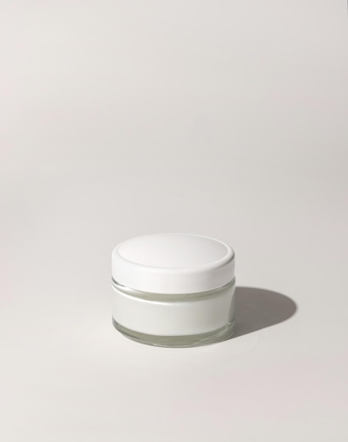 Cosmetic jar with a lid on white close up mockup Everyday skincare routine