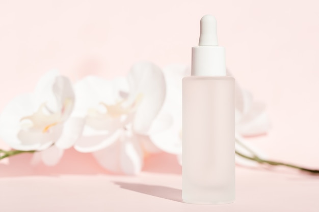 Cosmetic liquid mockup in transparent bottle