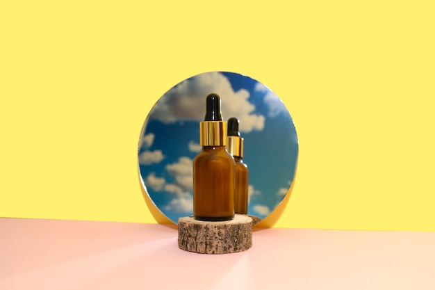 Cosmetic lotion on a wooden podium in the mirror reflects the blue sky