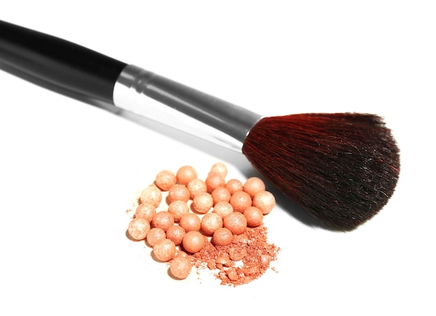 Photo cosmetic powder balls and makeup brush isolated on white