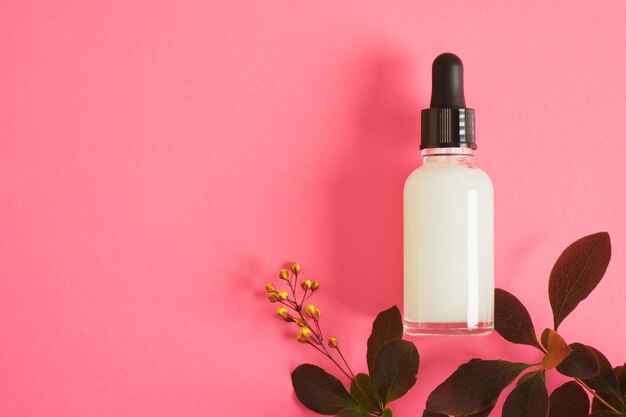 Cosmetic serum for skin care in a transparent dropper bottle