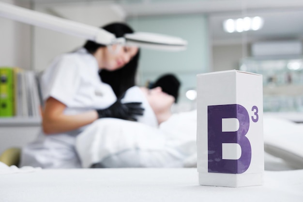 Cosmetic with vitamin B3 are on the table against the backdrop of the cosmetologist's office